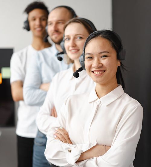 Diverse group of office workers smiling and feeling refreshed.
